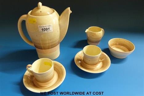 Susie Cooper Productions Crown Works earthenware kestrel shape coffee set for two, comprising coffee pot and cover, milk, sug
