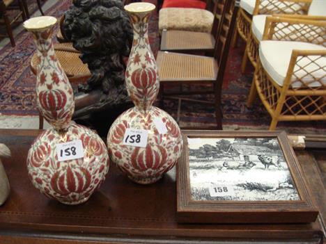 A Victorian Minton tile depicting sheep mounted in walnut as a teapot stand and a pair of Victorian bottle vases 