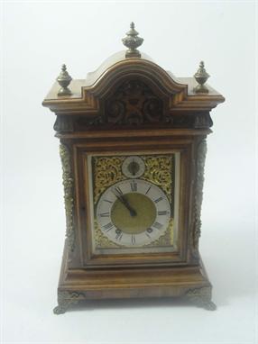A late 19th century German walnut cased eight day mantel clock of architectural form, height 53cm. 
