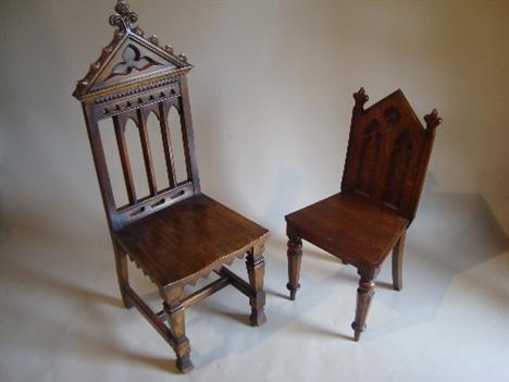 A late Victorian oak Gothic revival hall chair on square stretchered supports, also another with architectural back (2). 