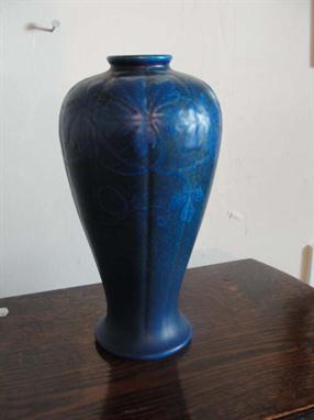 A Pilkington`s Royal Lancastrian blue ground lapis ware vase decorated with flowers, height 22cm. 