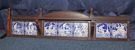 Seven blue and white Minton tiles, depicting various scenes of labour, printed in blue on white ground, in wooden mount, 127c