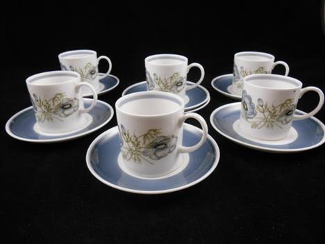 A Wedgwood Susie Cooper part coffee set comprising six coffee cups and saucers in the Glen Mist pattern, C1035