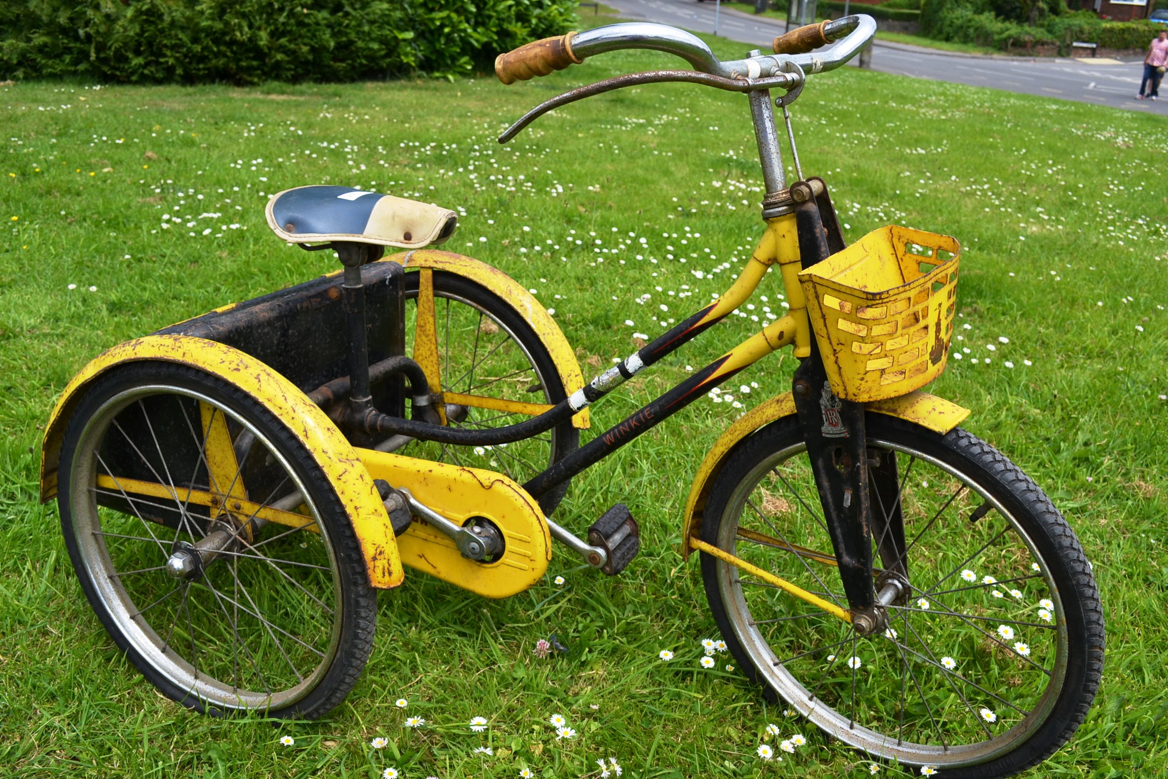 A 1950's Raleigh Winkie child's tricycle, in yellow and black colour
