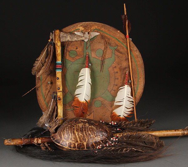 A NATIVE AMERICAN STYLE ARTIFACT GROUP, 20TH CENTURY.   Comprising a polychrome, feather and bird